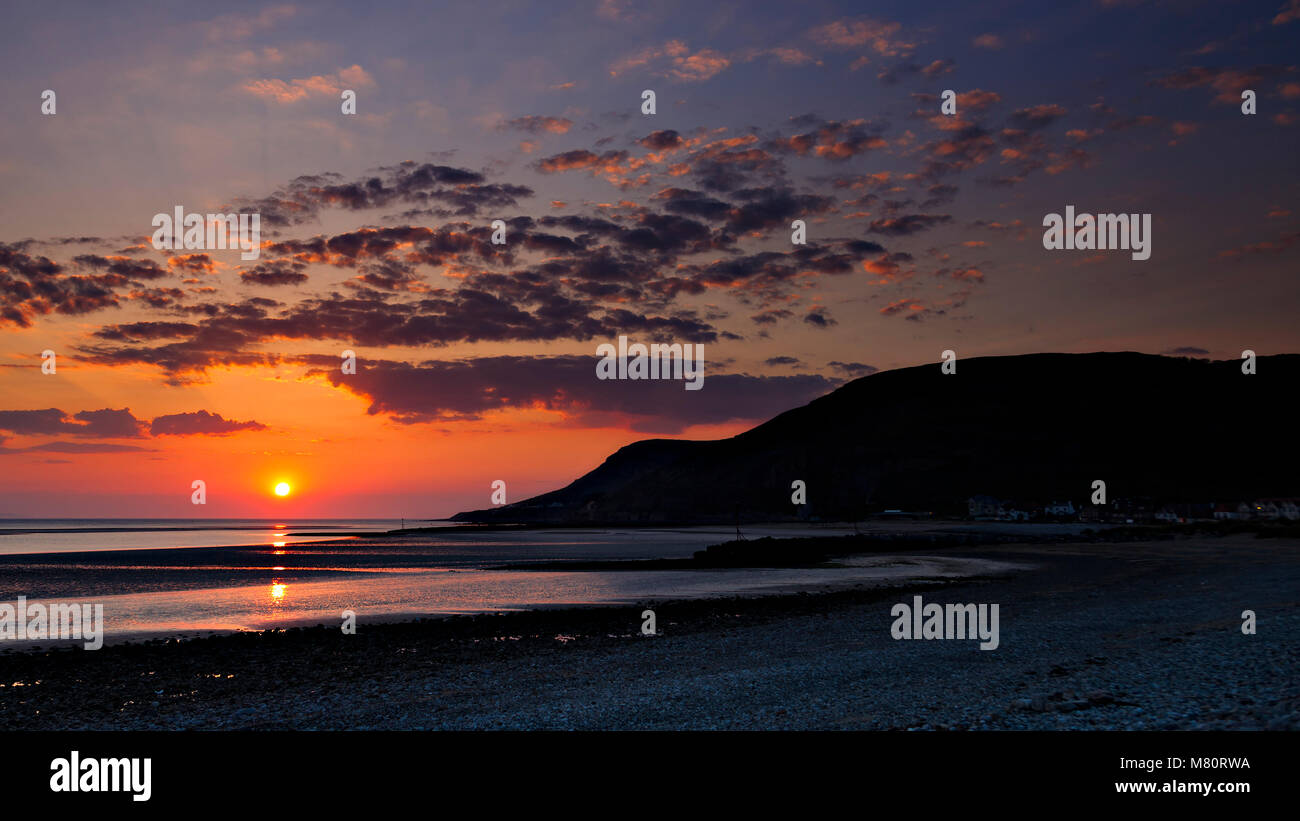 Sunset at low tide over the North Wales coast at Llandudno West Shore Stock Photo