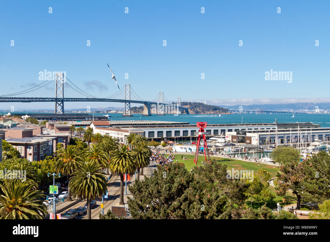 An elevated view of the Embarcadero in San Francisco, CA with the Bay Bridge and Treasure Island in the background. Stock Photo