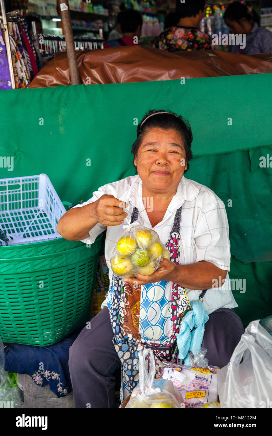 CHIANG MAI, THAILAND - AUGUST 24: Woman sells fruits at the market on ...