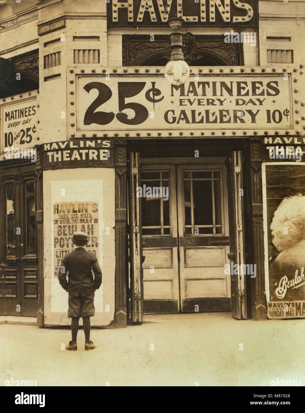 Young Boy Outside, Motion Picture Theater, St. Louis, Missouri, USA, Lewis Hine for National Child Labor Committee, May 1910 Stock Photo