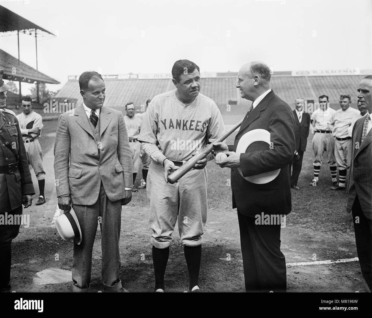 Babe Ruth of the New York Yankees Signing Baseball Bat before Game, Griffith Stadium, Washington DC, USA, Harris & Ewing, 1928 Stock Photo