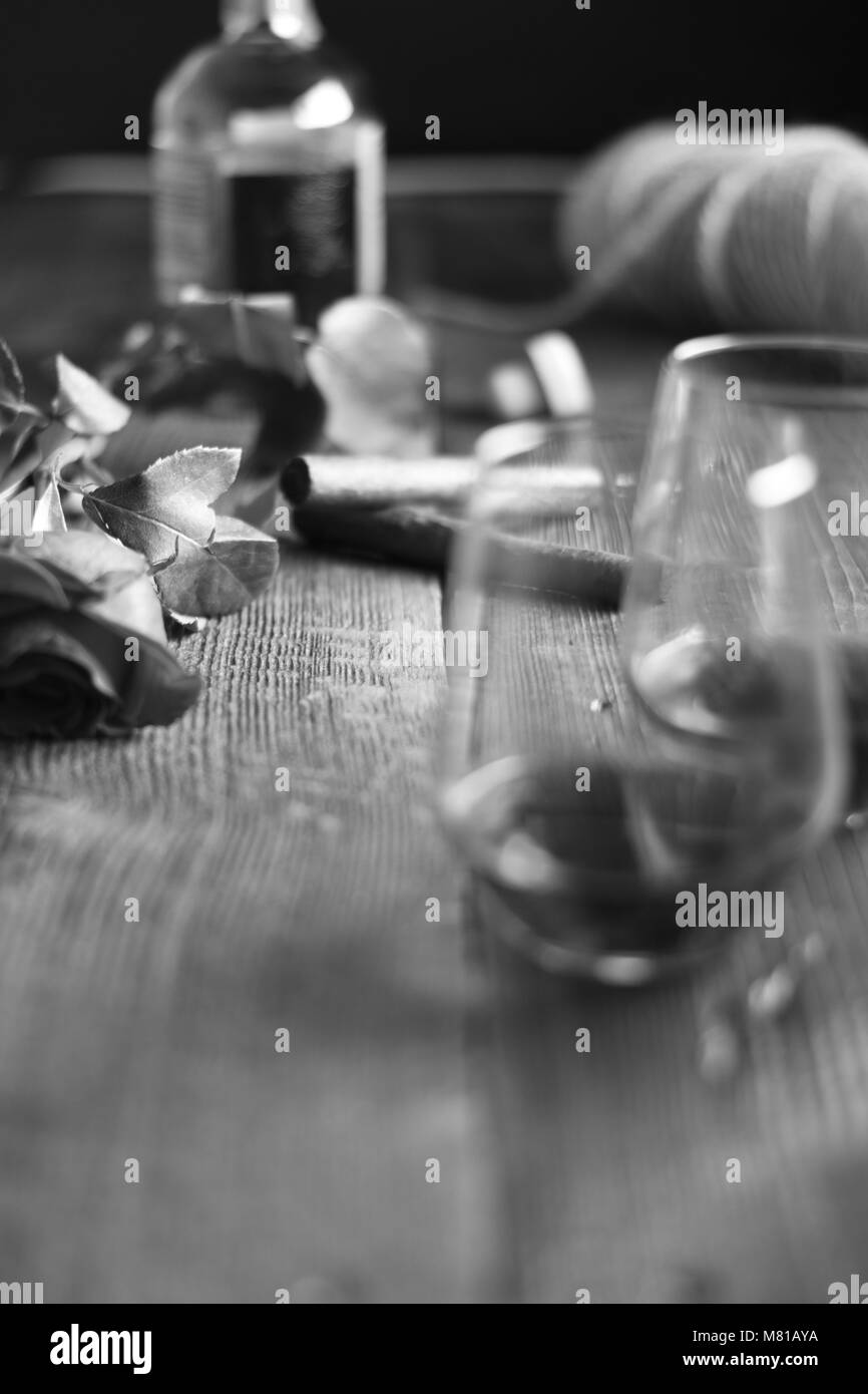 Vintage tools of Glass of rum on a rustic wooden table with cigars and bottle.barber shop on wooden background Stock Photo