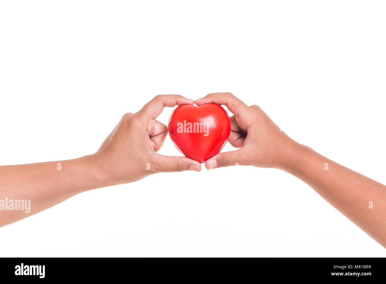 Love Mom Concept : Daughter holding and giving red heart to her mother hand isolated on white background Stock Photo