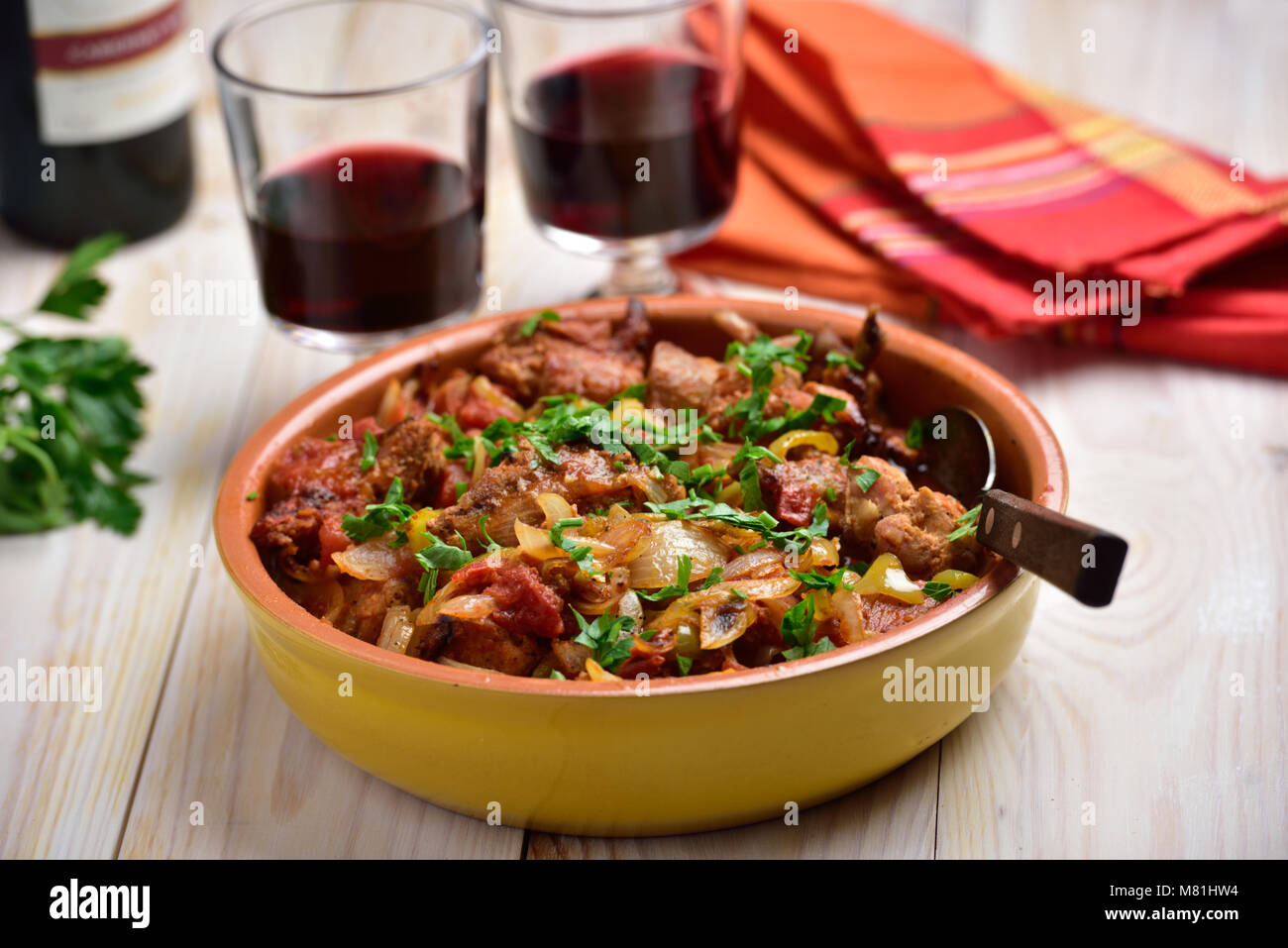Rabbit stew a basque with onion, pepper, and parsley Stock Photo