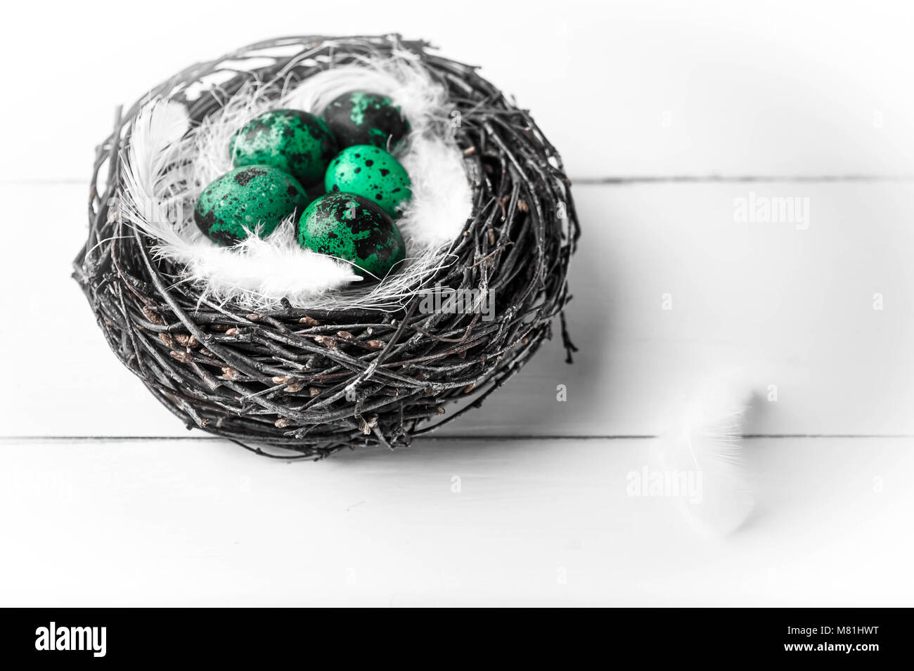 Nest with eggs on a white wooden background. Easter background with ...