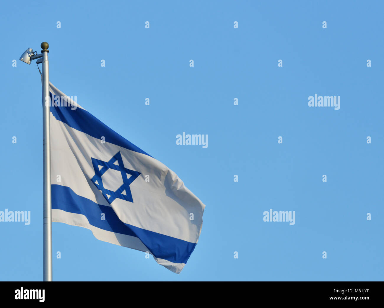 Flag on Israel waving on the wind against blue sky Stock Photo - Alamy