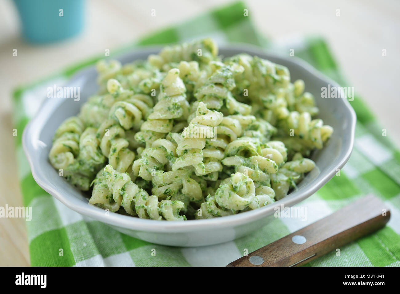 Fusilli pasta with spinach and ricotta cheese in a bowl Stock Photo