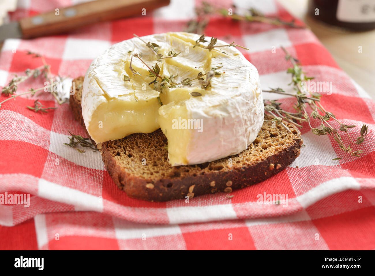 Baked Camembert cheese with thyme Stock Photo