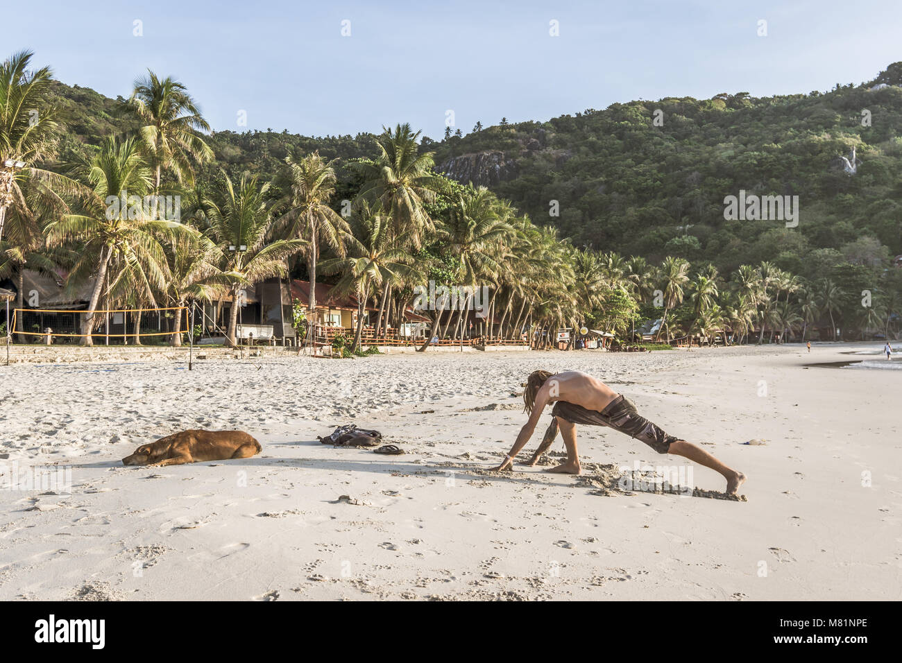 Man sleeping on beach hi-res stock photography and images - Alamy