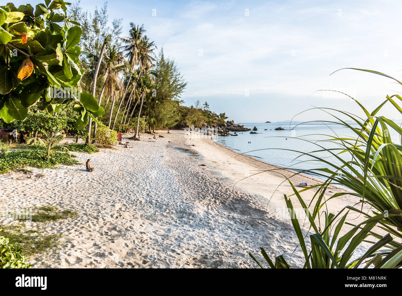 Paradise beach with som peple relaxing in the lateafternoon sunshine. Secret Beach, Haad Son, Koh Pangan, Thailand, May 8, 2016, Stock Photo