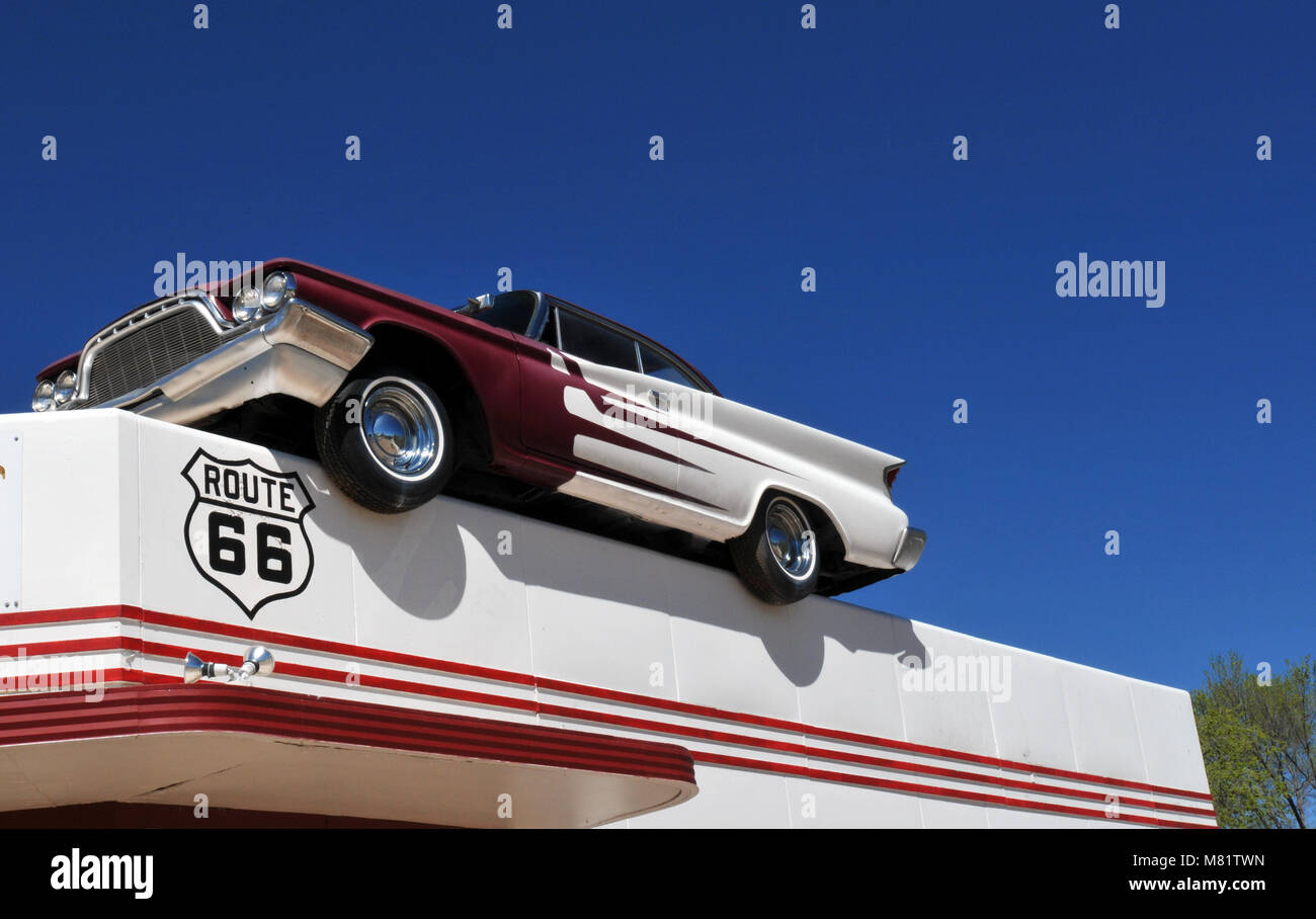 A classic DeSoto automobile sits atop the roof of DeSoto's Salon along Route 66 in Ash Fork, Arizona. Stock Photo