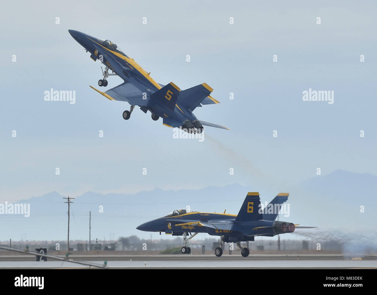 180310-N-ZC358-080  NAF EL CENTRO, Calif. (March 10, 2018) Blue Angels Lead Solo Pilot, Lt. Tyler Davies, performs a Dirty Roll on Takeoff, while Opposing Solo Pilot, Lt. Brandon Hempler, prepares to perform a Low Transition to High Performance Climb, during the NAF El Centro 2018 Air Show. The Blue Angels are scheduled to perform more than 60 demonstrations at more than 30 locations across the U.S. in 2018. (U.S. Navy photo by Mass Communication Specialist 2nd Class Jess Gray/Released) Stock Photo