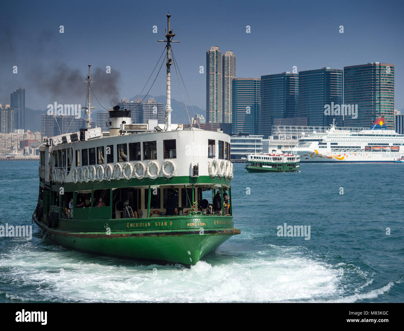 Hong Kong Star Ferry leaves Hong Kong for Kowloon Stock Photo
