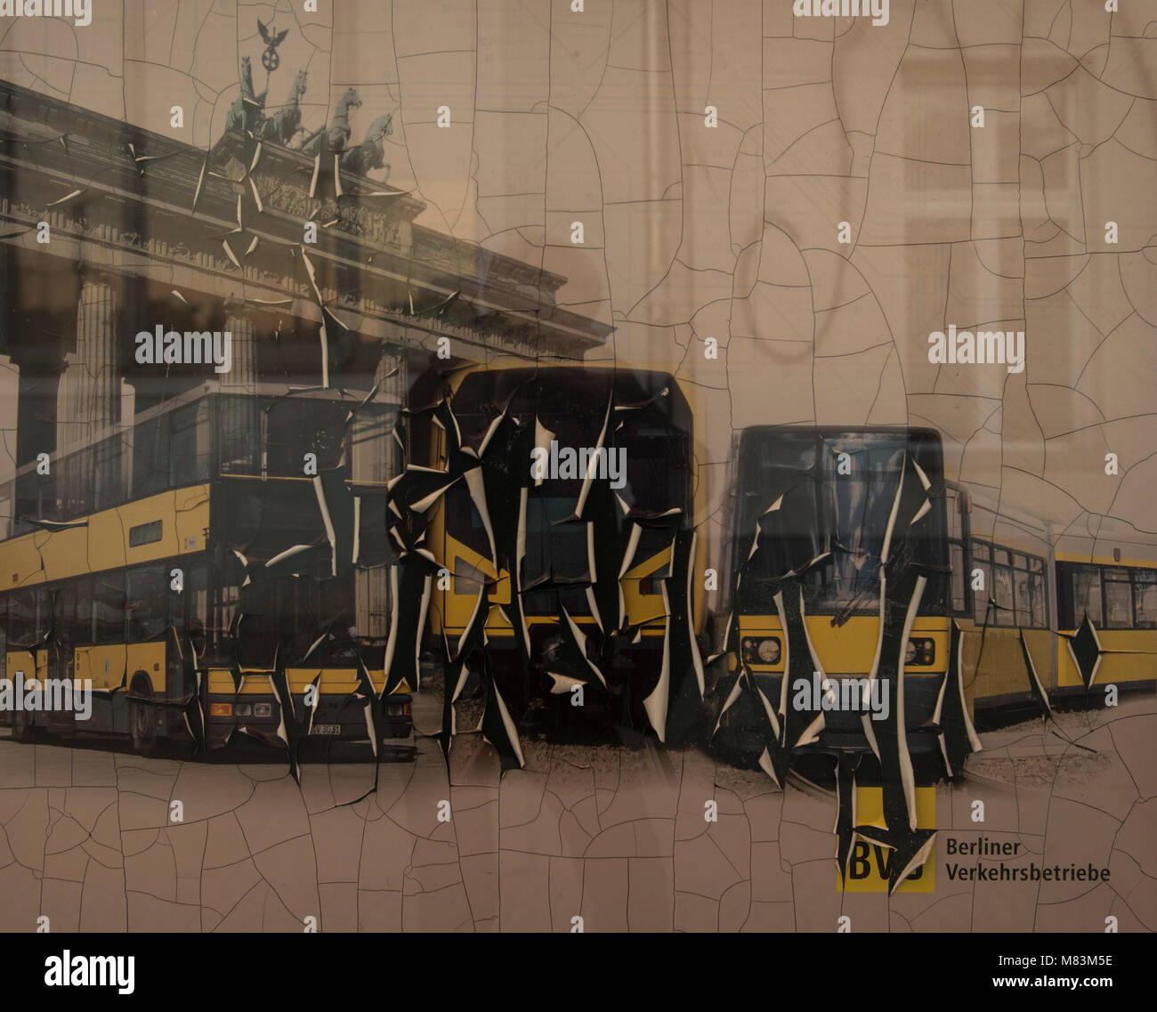Partly perished poster of BVB with buses and Brandenburg Gate, Berlin, Germany Stock Photo