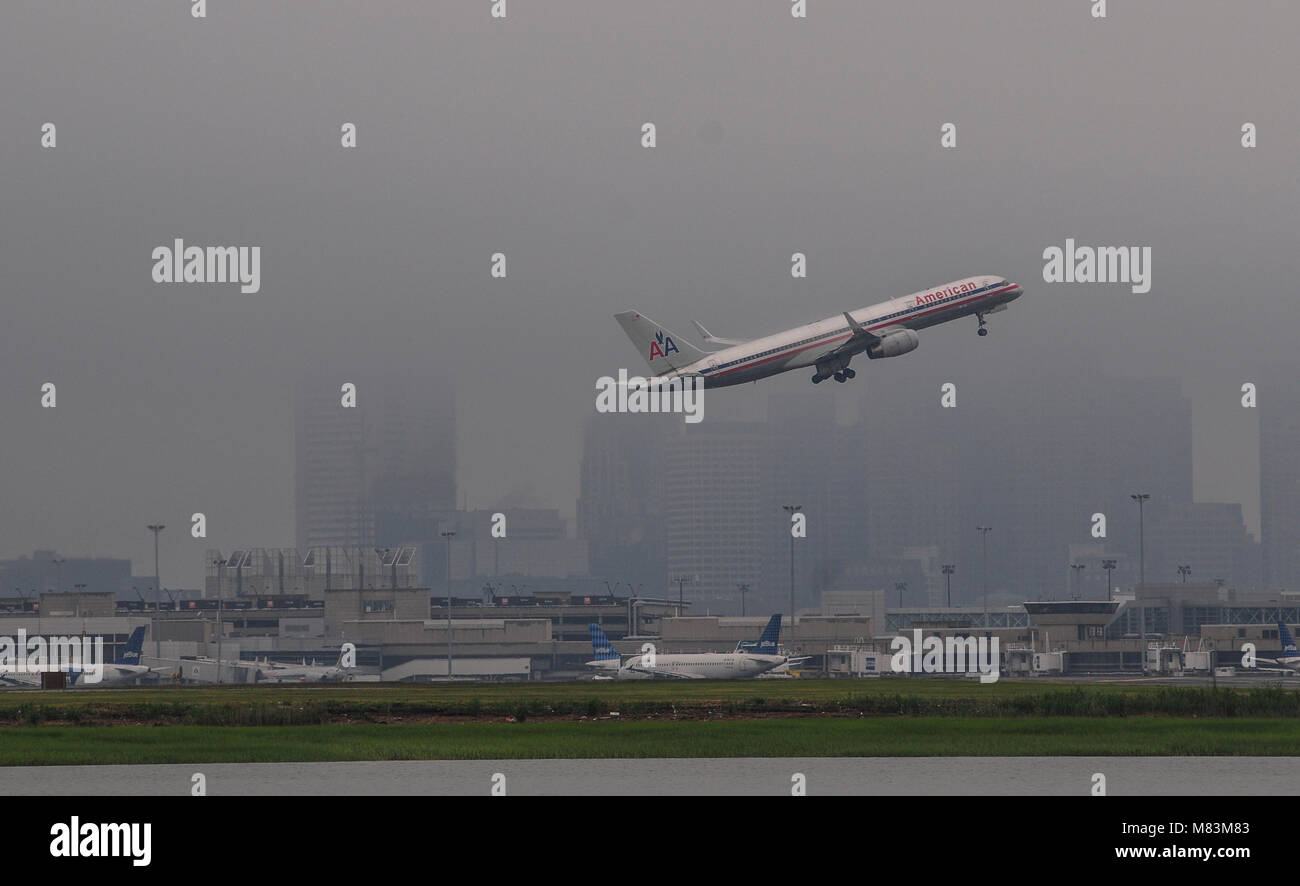 Commercial airplane taking off from airport, Boston, Massachusetts, USA Stock Photo