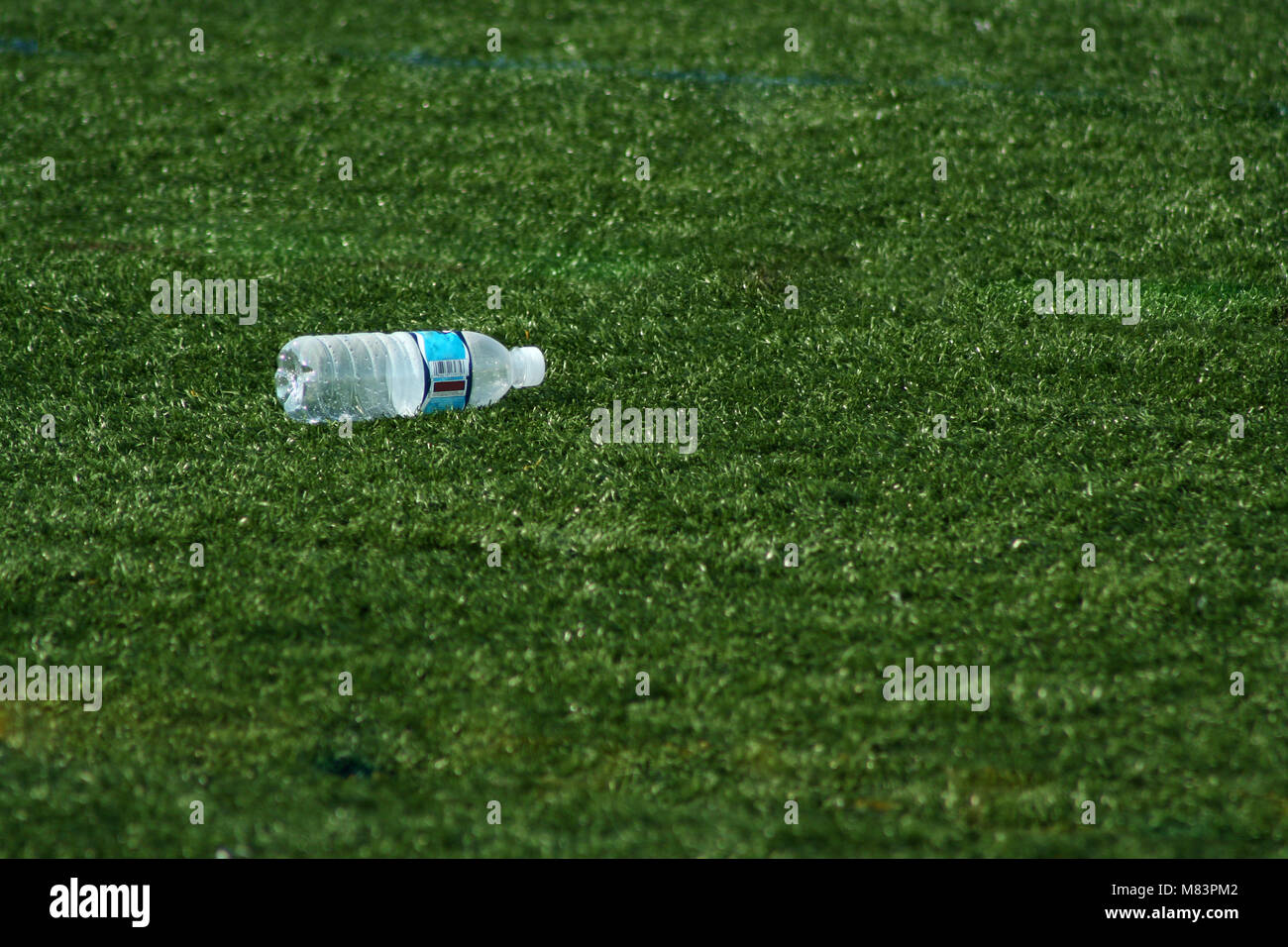 Bottle of water on the green grass Stock Photo - Alamy