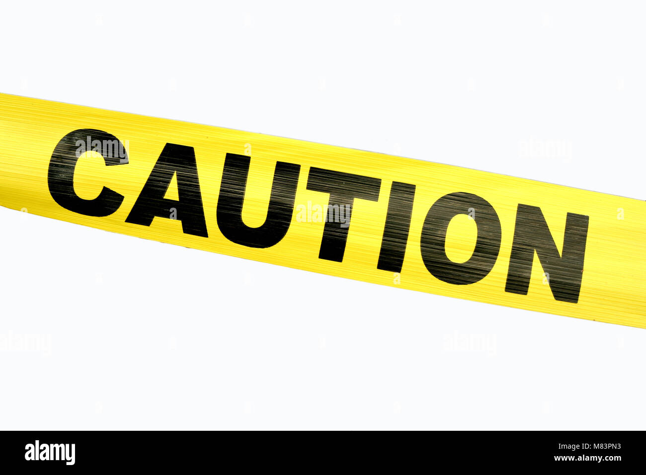Yellow Caution Tape against a white background Stock Photo Alamy