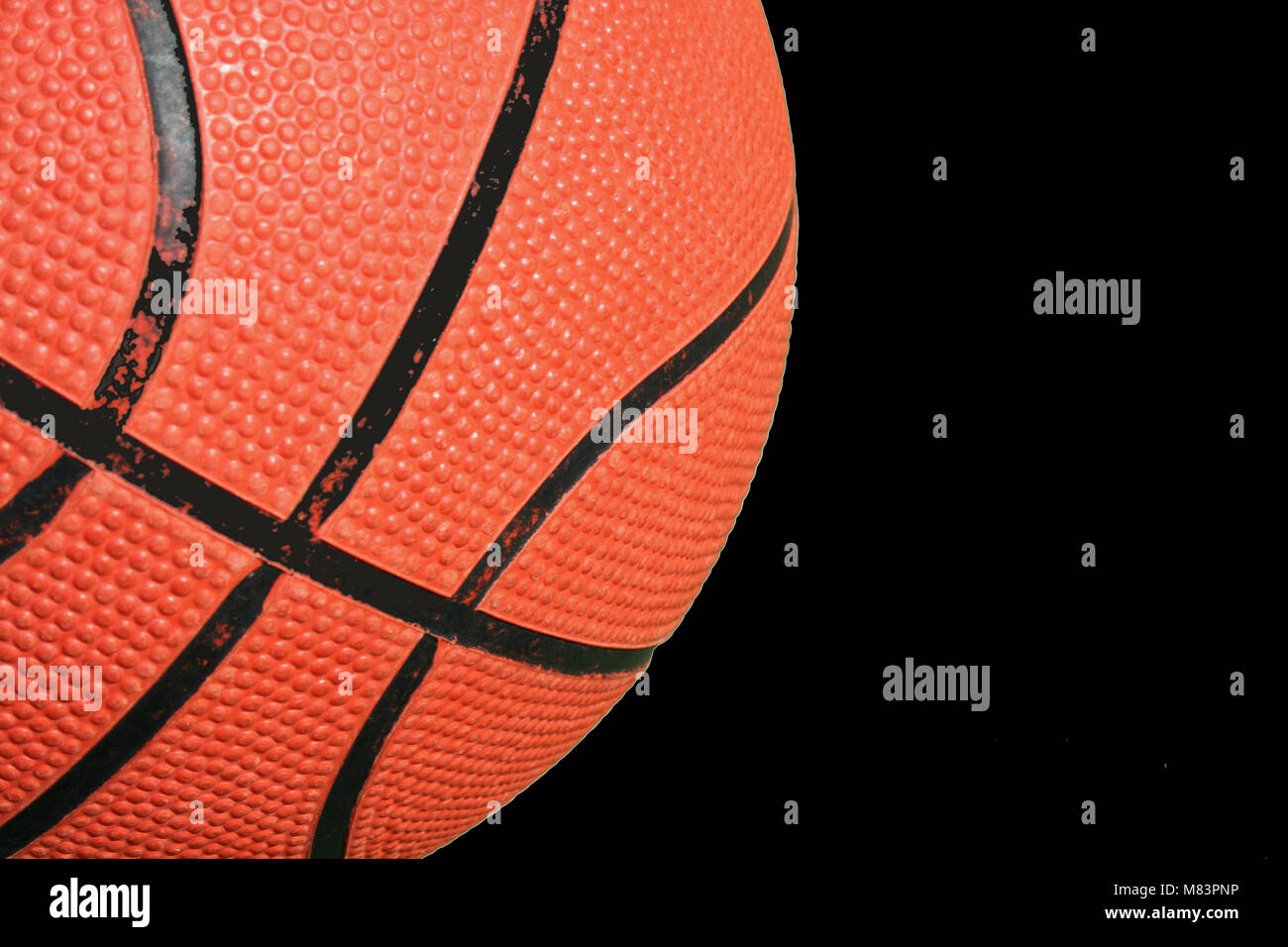 A Basketball close up on green court Stock Photo