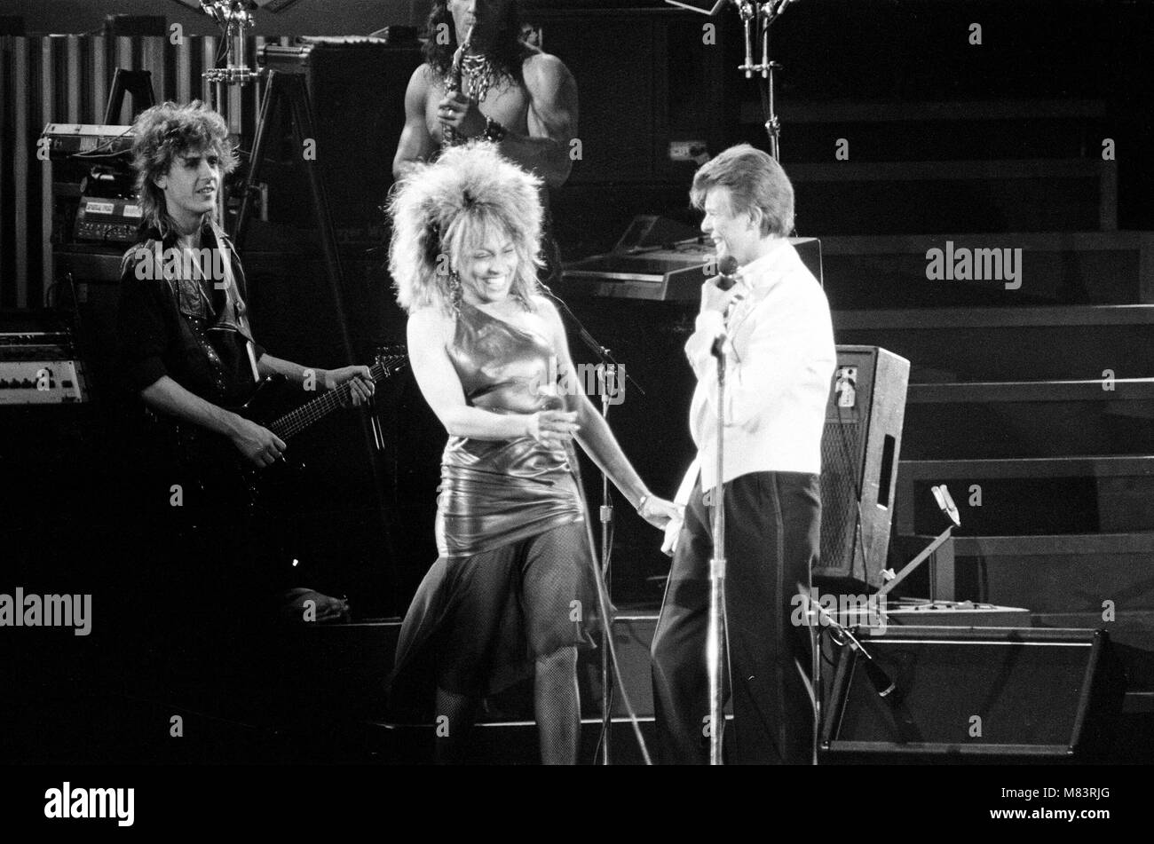 David Bowie and Tina Turner on stage together at the Birmingham NEC.  The concert is part of Tina Turner's Private Dancer Tour. David Bowie joined her late on in the set to duet on 2 of his own songs 'Tonight' and 'Let's Dance'.  Picture taken 23rd March 1985 Stock Photo