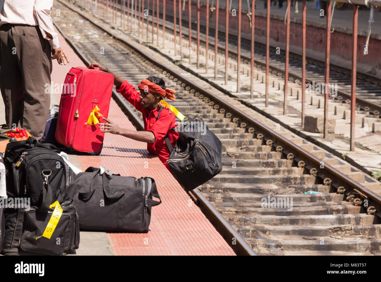 Indian railway station porter hires stock photography and images Alamy