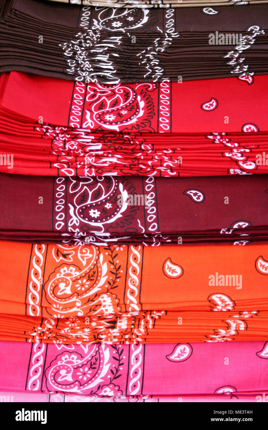 Different colored Bandanas layed out for sale Stock Photo
