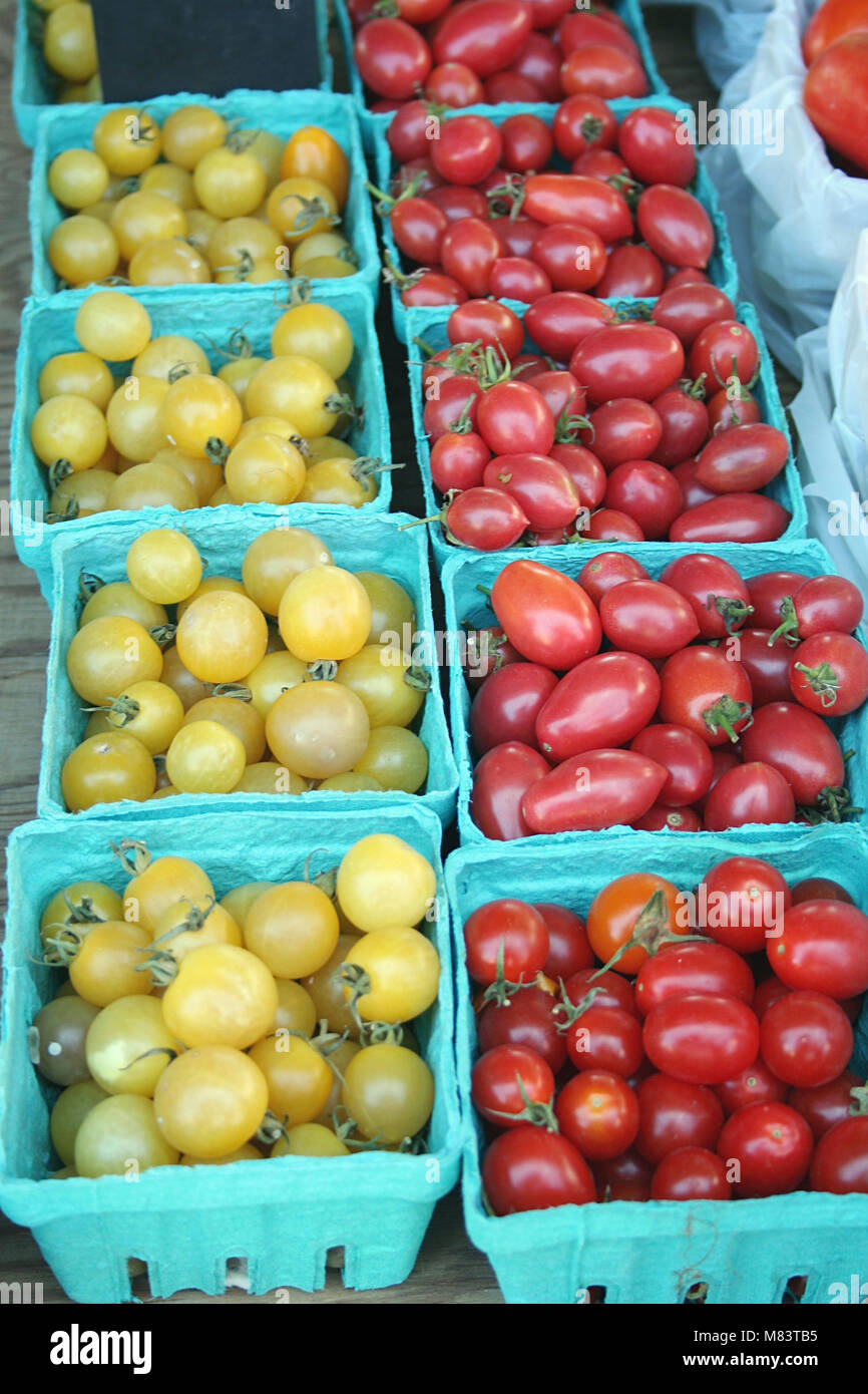 Baskets of yellow and red Cherry Tomatoes Stock Photo