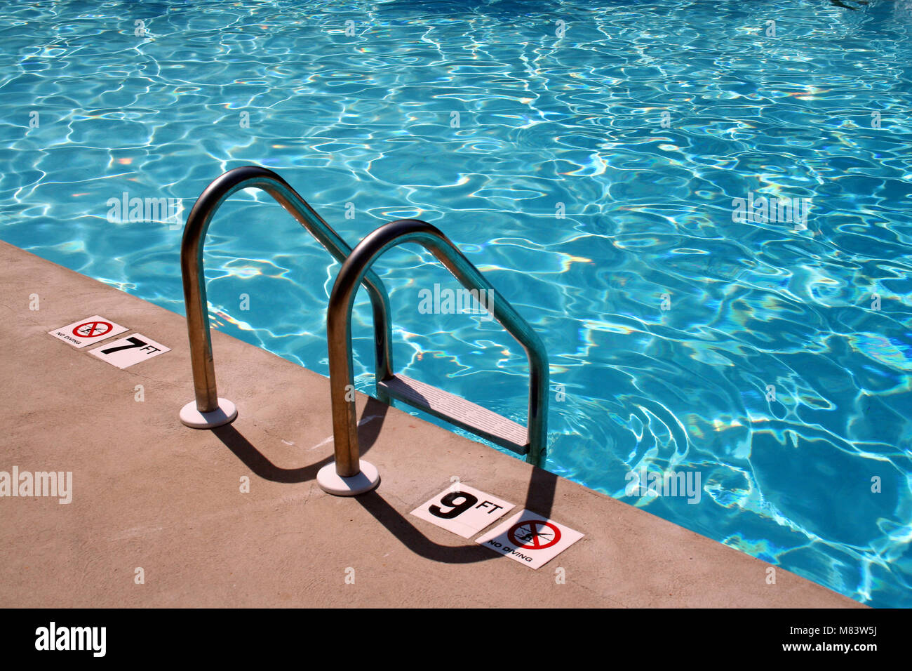 an image of a Swimming pool Ladder Stock Photo