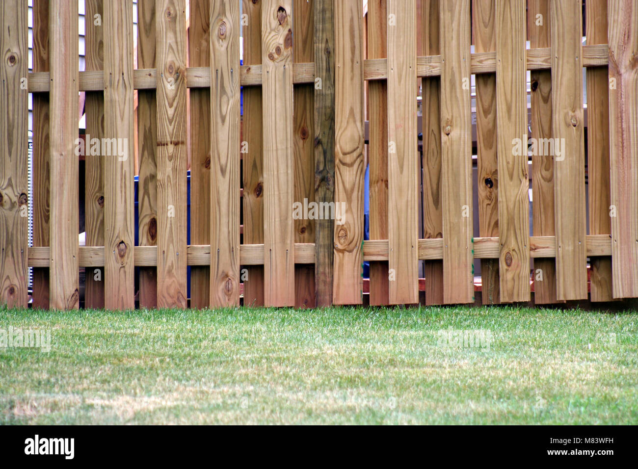 an image of a Board on Board Wood Fence Stock Photo - Alamy