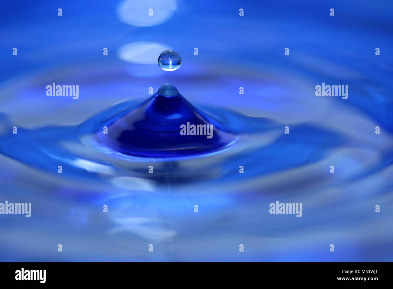 A blue water droplet splashing Stock Photo - Alamy