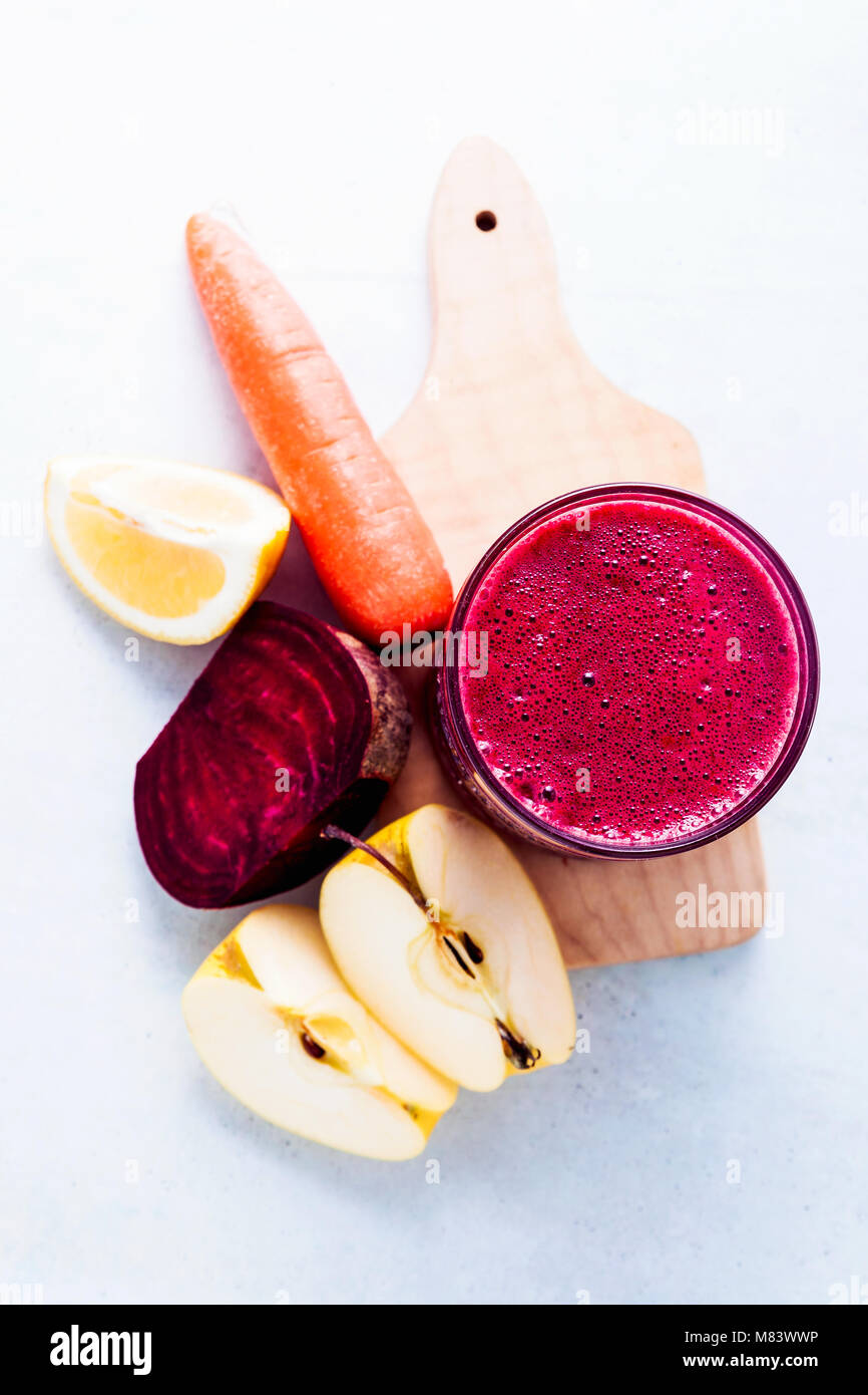 healthy freshly squeezed Juice from Beets, carrots, apples and lemon. detox program, healthy eating, concept of vegans Stock Photo