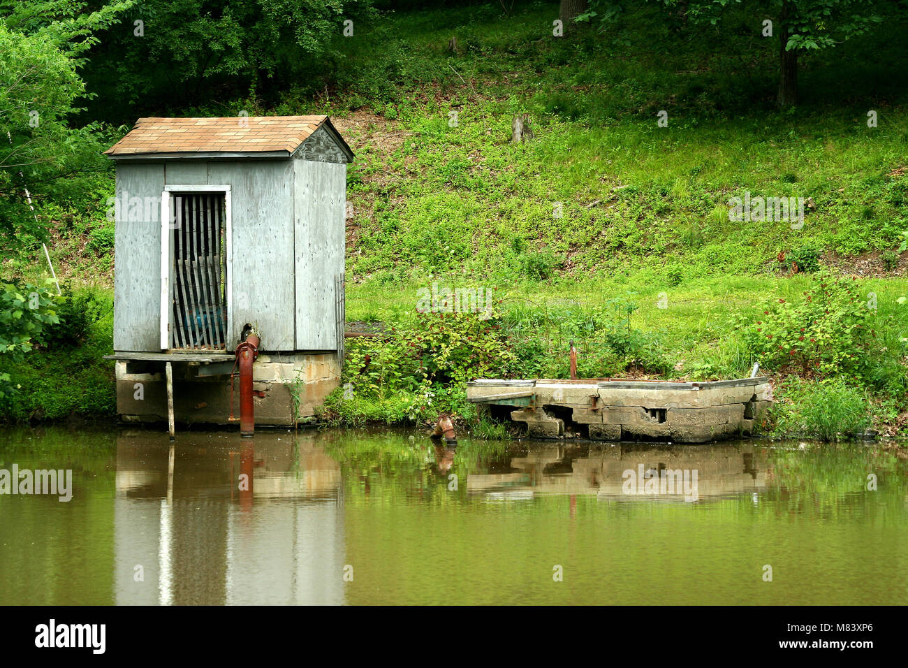 A Pump house on a small pond Stock Photo - Alamy