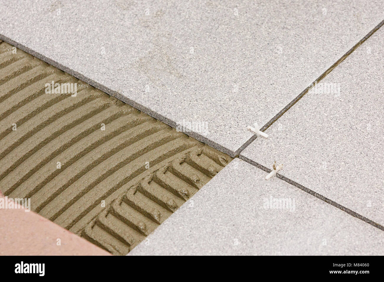 Laying ceramic tiles hires stock photography and images Alamy