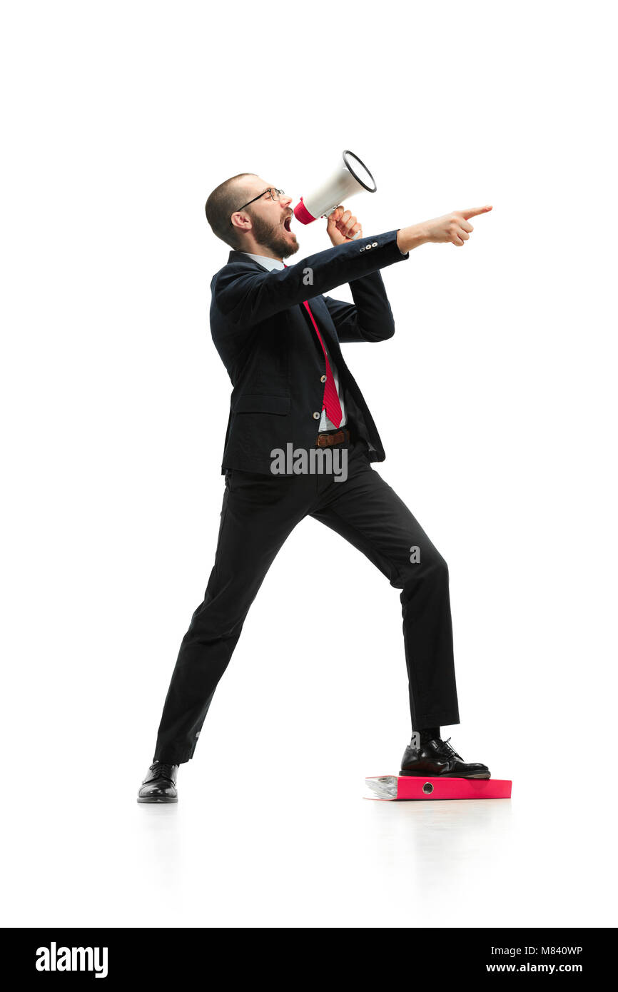 Side view of a man screaming on the megaphone over white background ...