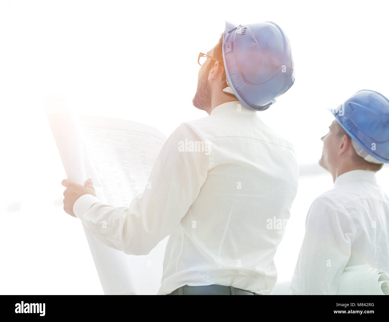 rear view.architect and Builder looking at blank screen Stock Photo