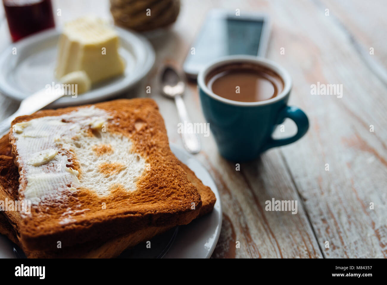 Breakfast of businessman with coffee and phone. Toast with bitcoin symbol. Bitcoin  exchange rate on phone screen Stock Photo - Alamy