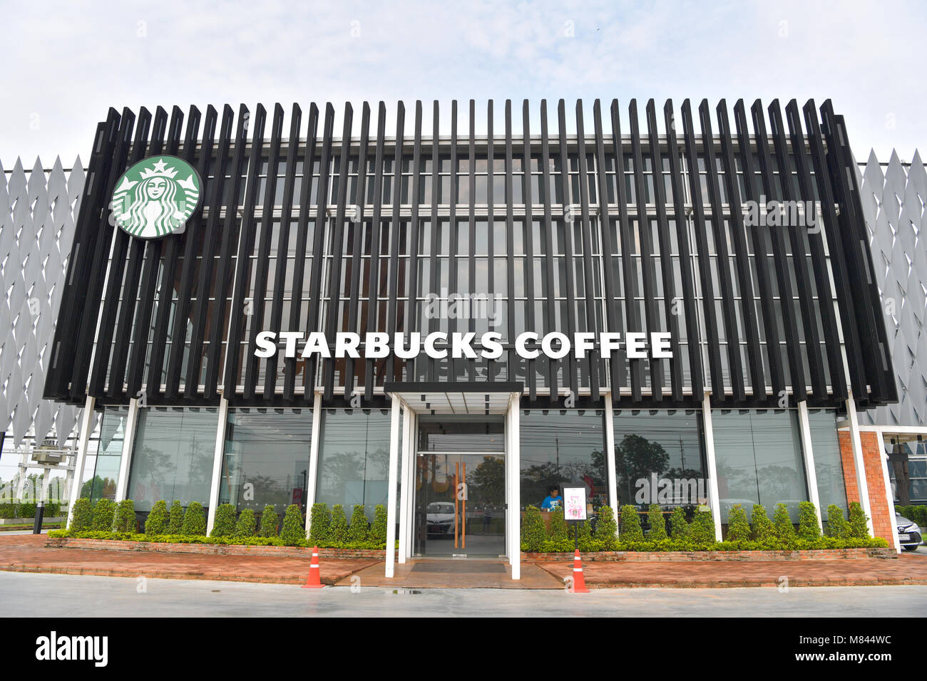 AYUTTHAYA - MARCH 10 : Starbucks Coffee in Thailand, Corporation is An American global coffee company and coffeehouse, during the day hours on March 1 Stock Photo