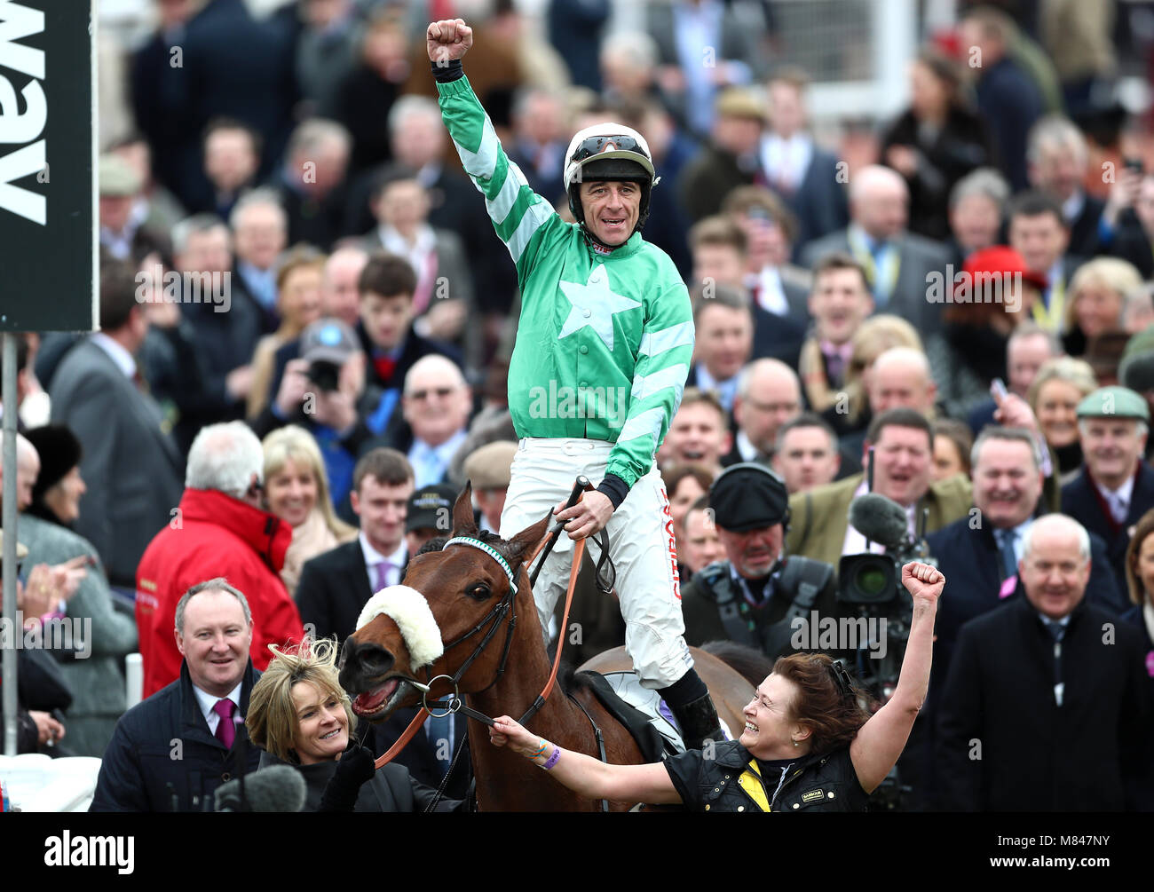 Jockey Davy Russell (centre) celebrates winning the RSA Insurance ...