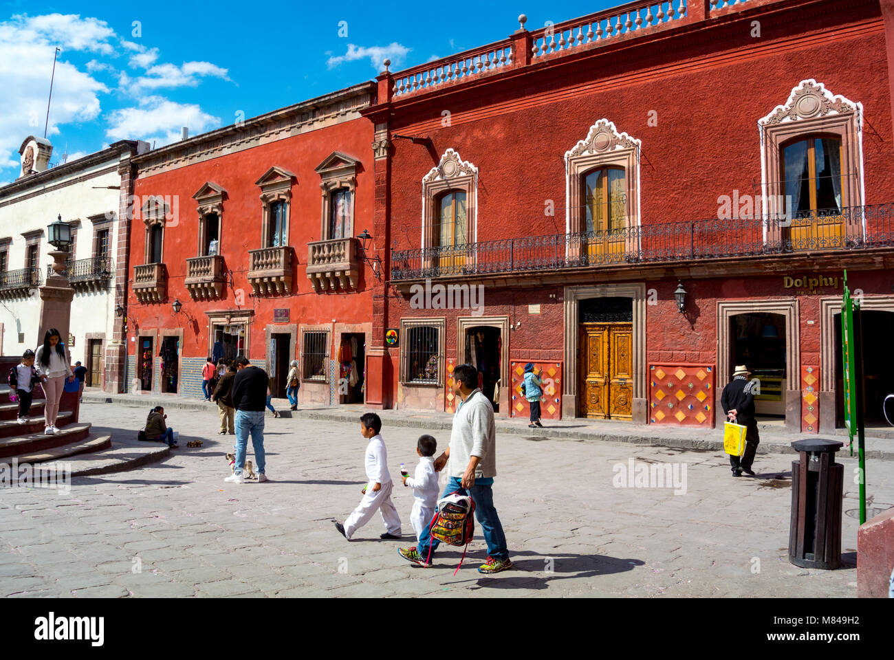 Local people walking at zocalo, San Miguel de Allende, Guanajuato, Mexico Stock Photo