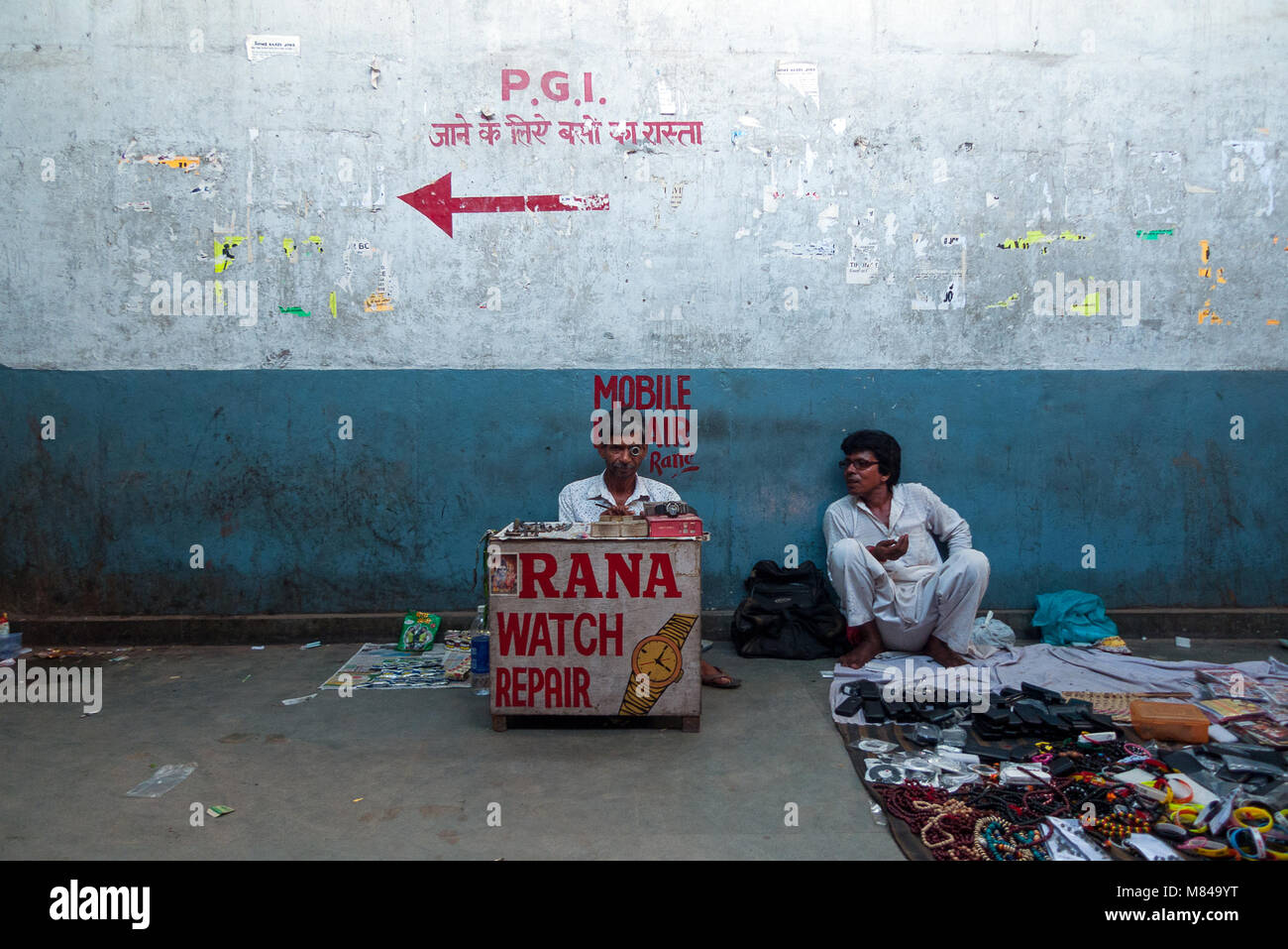 Chandigarh, India: A watchmaker inside an underpass in the city of Chandigarh Stock Photo