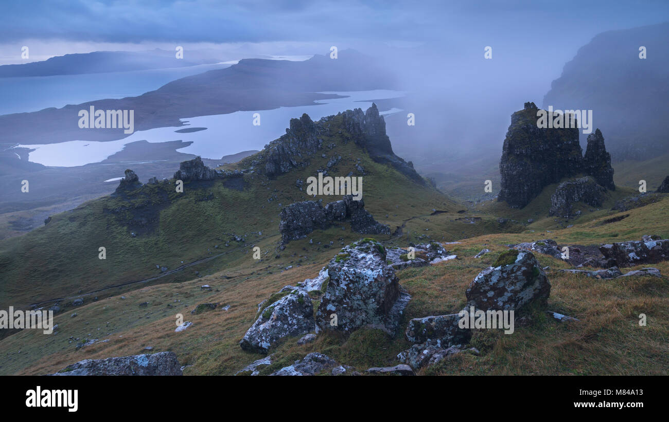 Jagged basalt peaks near the Old Man of Storr on a foggy morning, Isle of Skye, Scotland. Autumn (November) 2017. Stock Photo