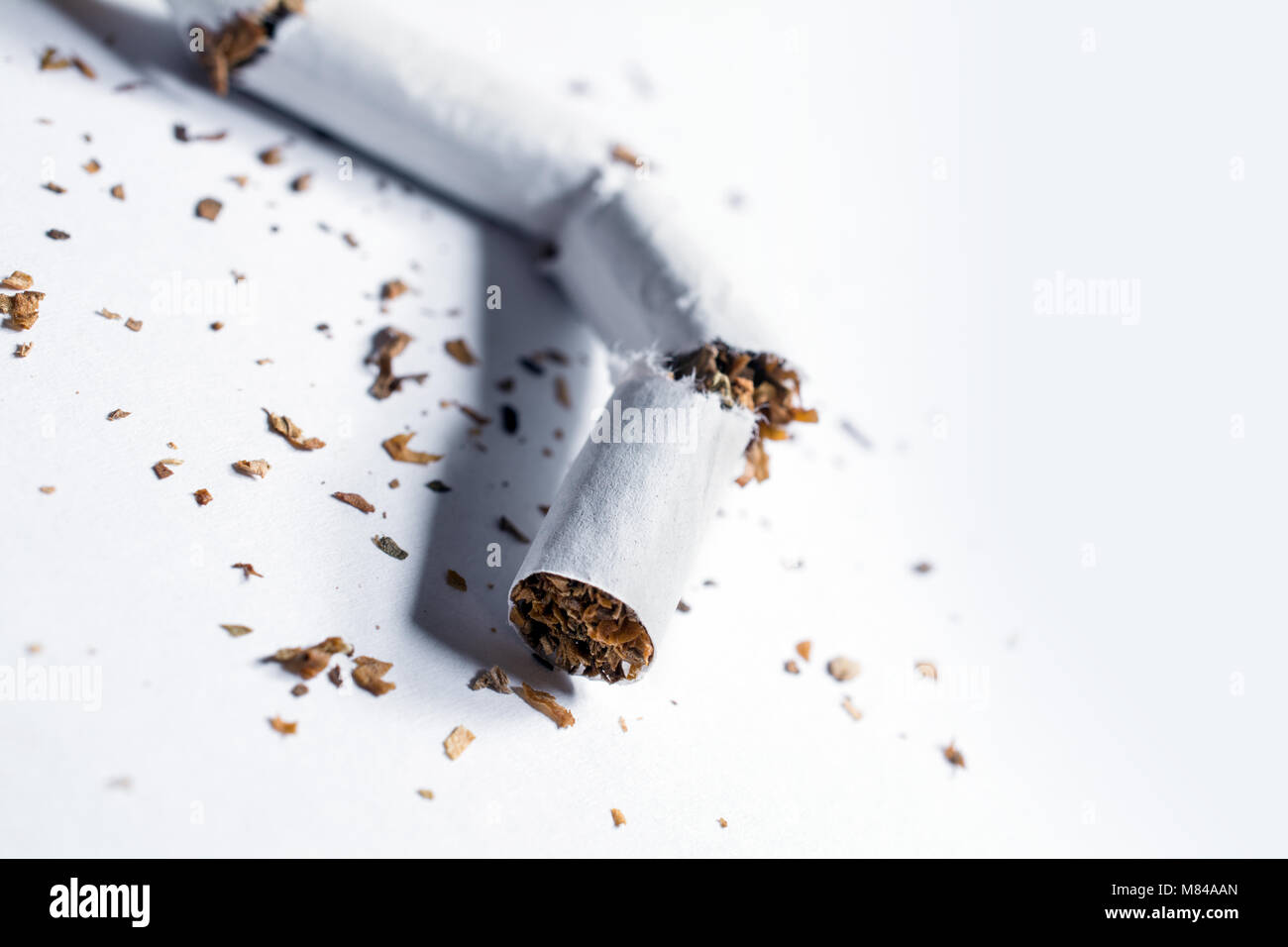 piece of tobacco Broken Cigarette With Tobacco Pieces In Whitebox Stock Photo