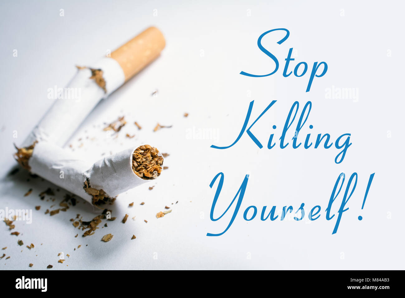 Stop Killing Yourself Smoking Reminder With Broken Cigarette In Whitebox  Stock Photo