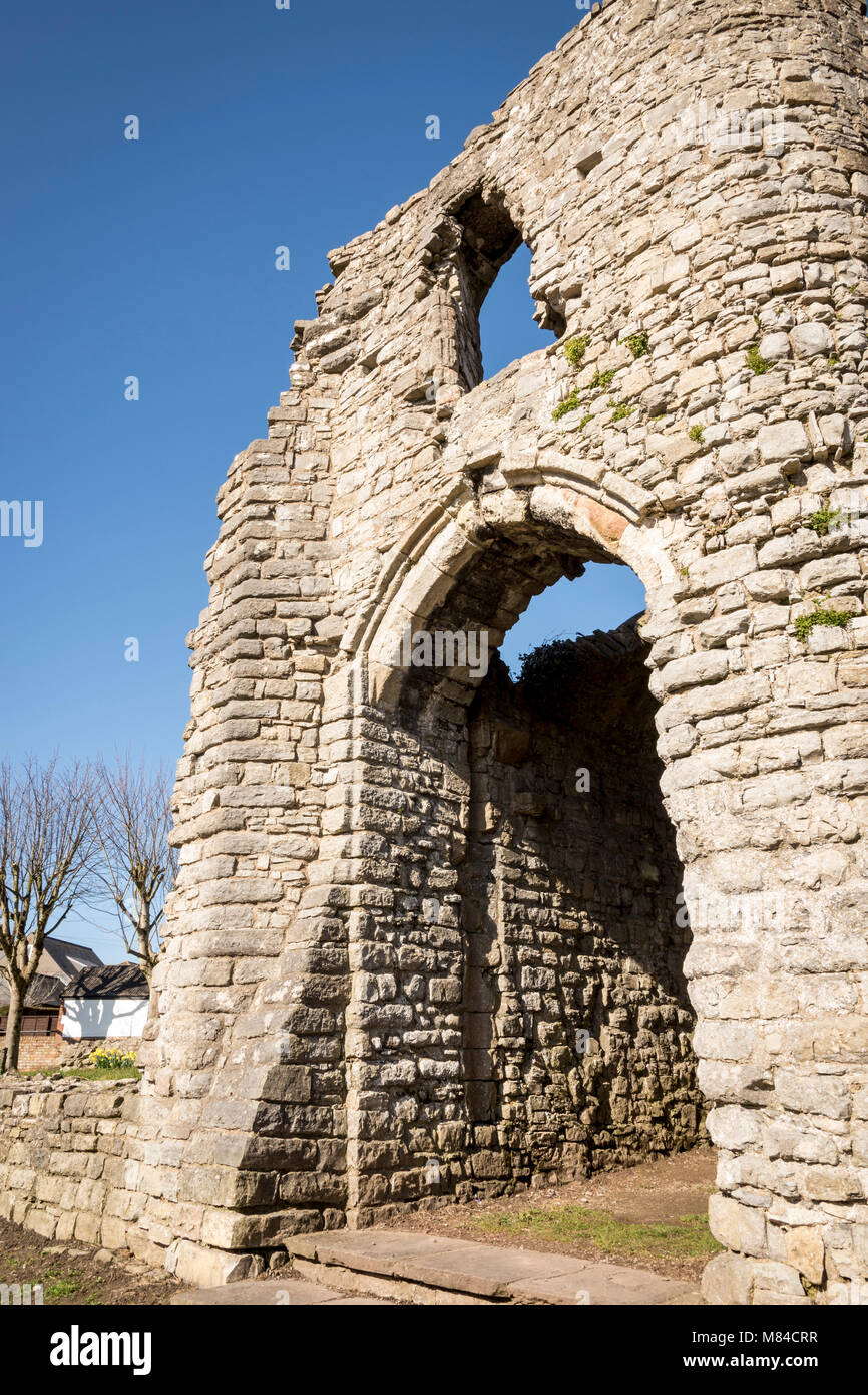 Gatehouse of Barry castle ruin lit by early morning sunshine under a clear blue sky Stock Photo