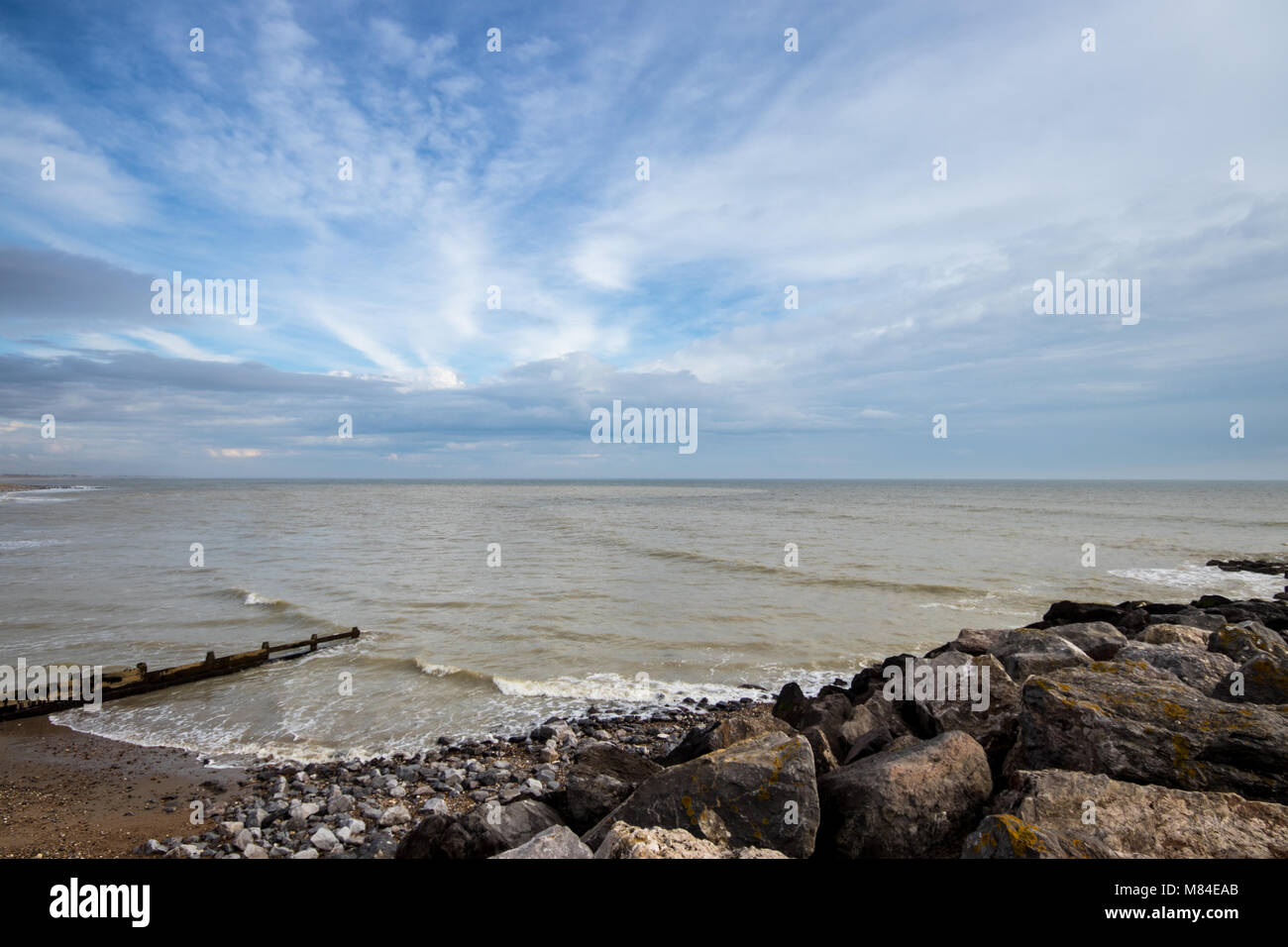 Landscape view of MiddletononSea beach (Elmer) at low tide with blue cloudy sky, near Bognor