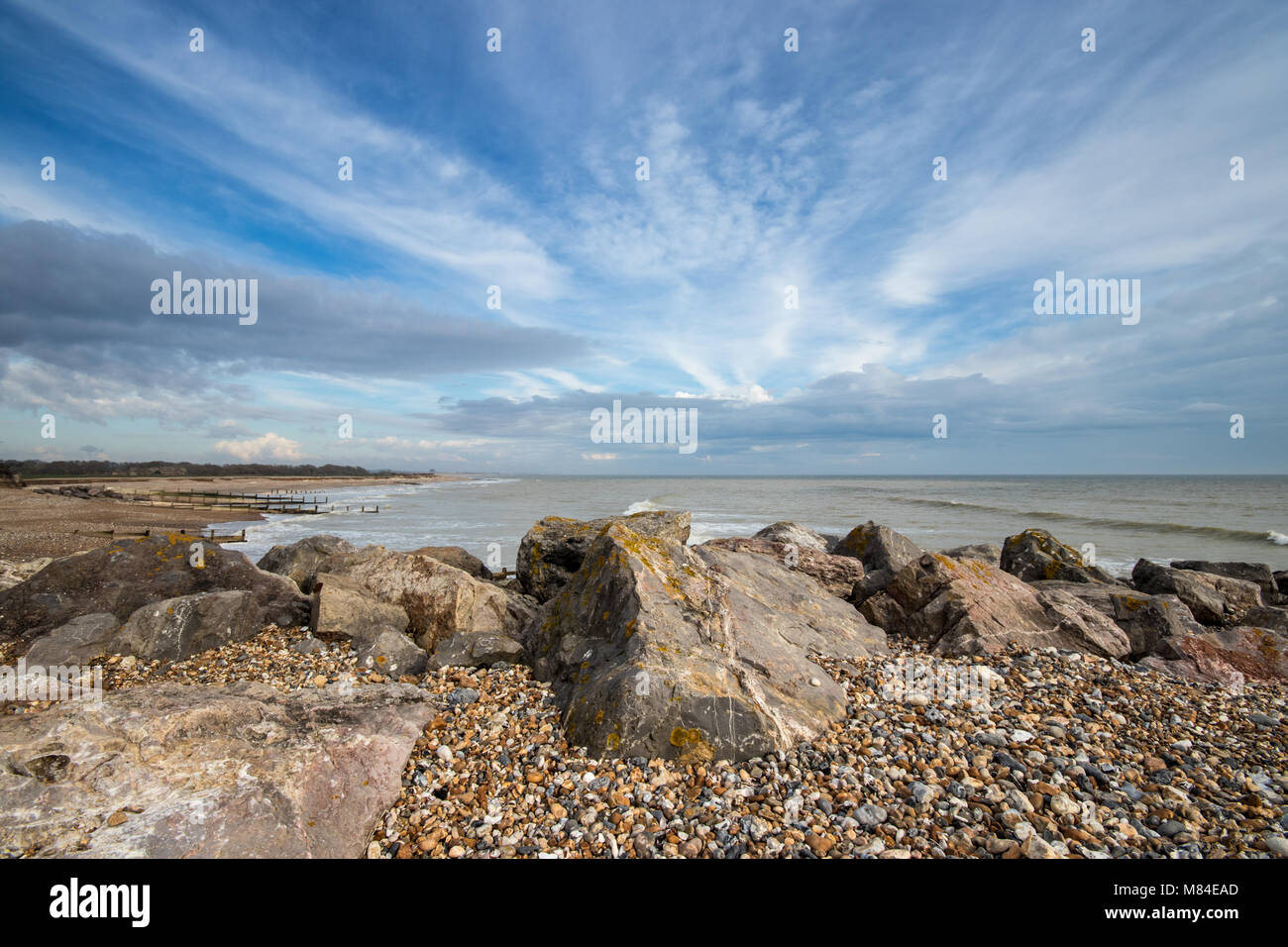 Landscape view of MiddletononSea beach (Elmer) at low tide with blue cloudy sky, near Bognor
