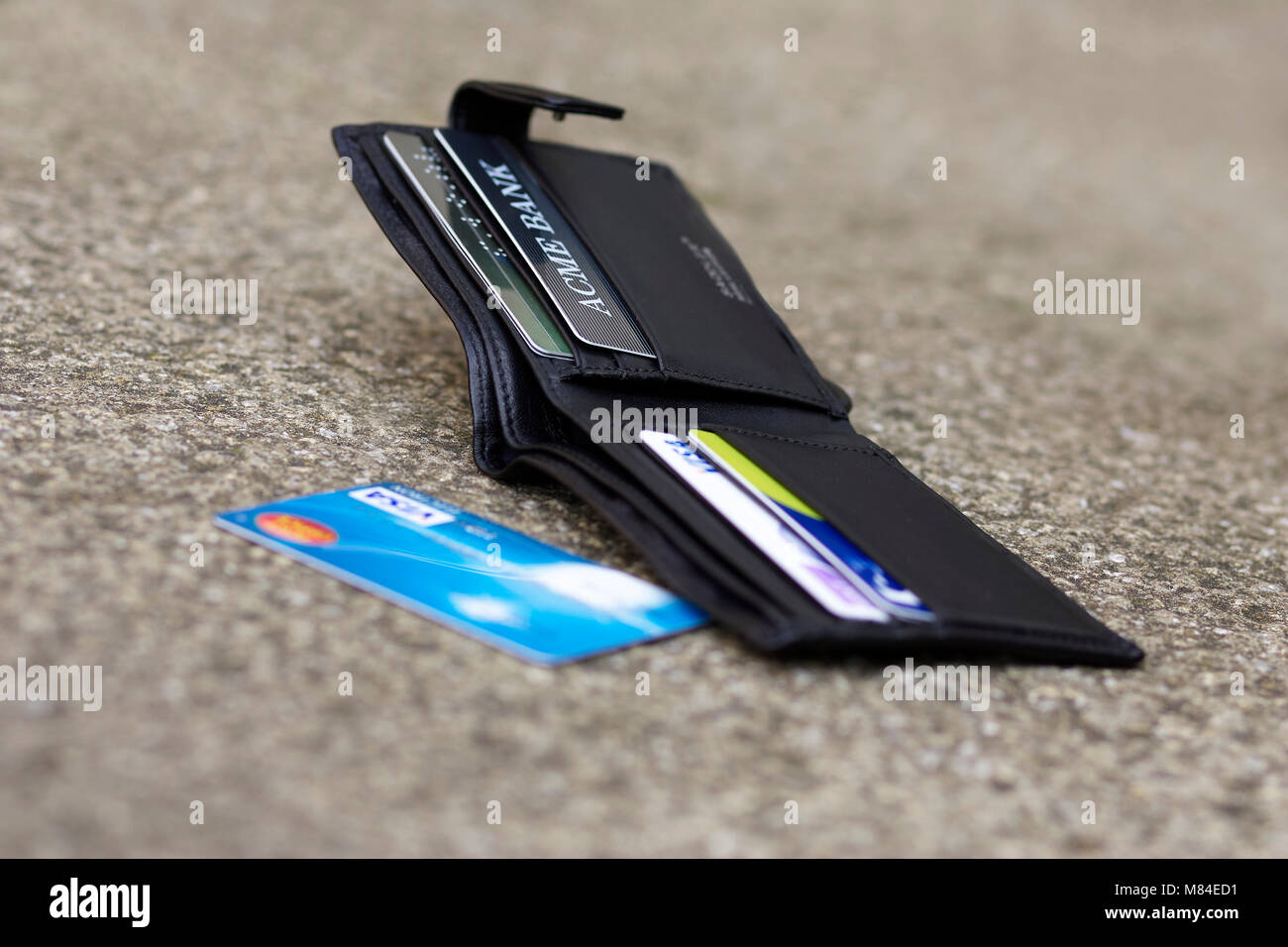 Dropped wallet laid on the floor Stock Photo
