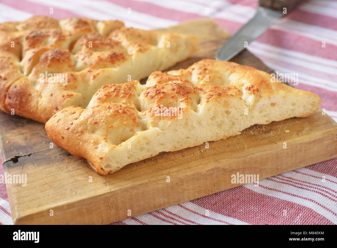 Turkish bread pide on a cutting board Stock Photo