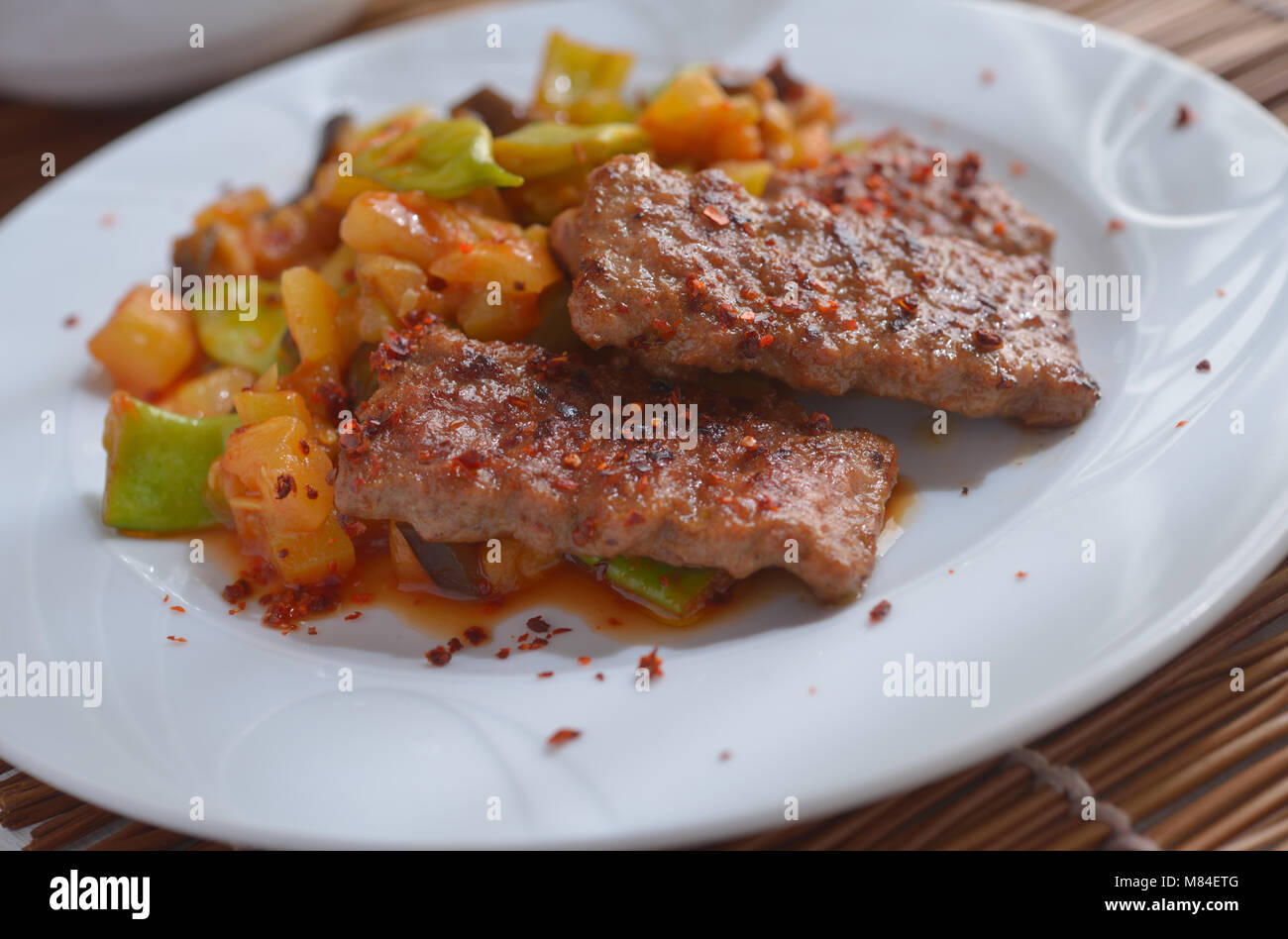 Adana kofte with roasted vegetables Stock Photo