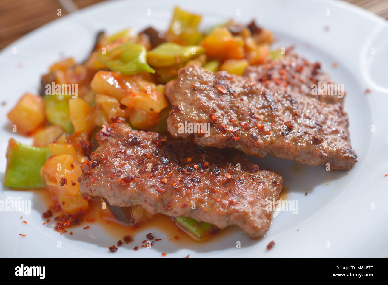 Adana kofte with roasted vegetables Stock Photo