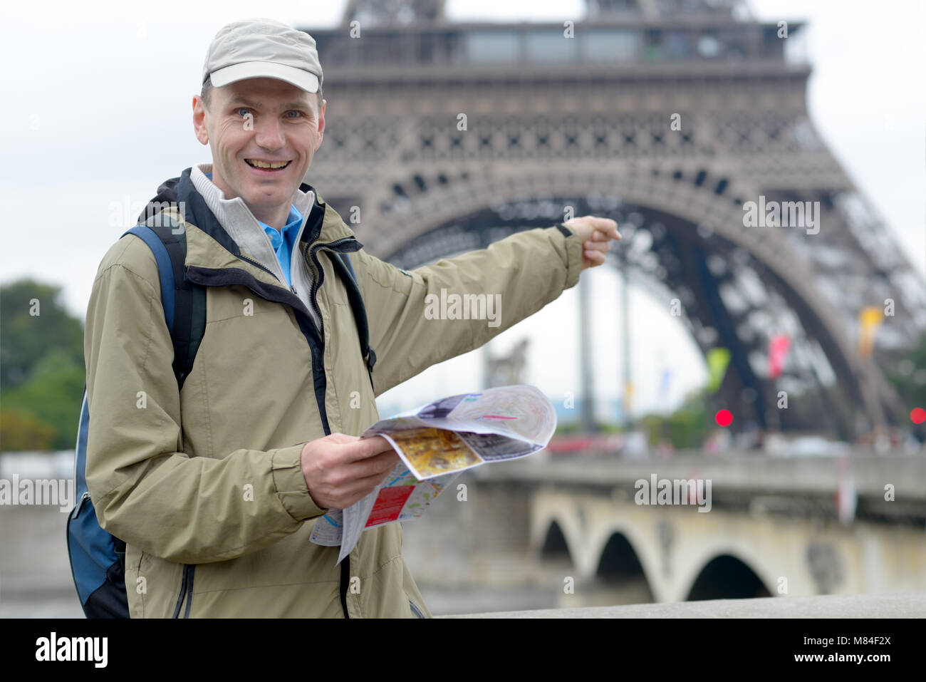 Tourist with a map in Paris, France Stock Photo